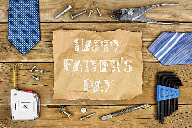 istock Happy Fathers Day on paper with frame on wood 527690364