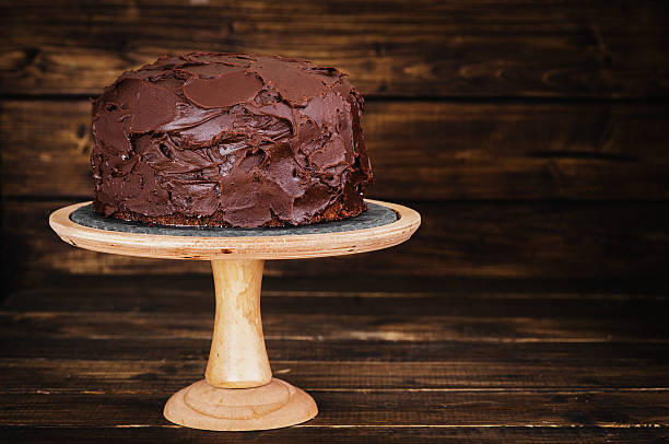 istock Chocolate cake on dark wooden bckground 527690940
