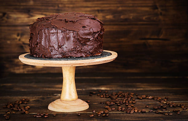 istock Chocolate cake on dark wooden bckground 527691428