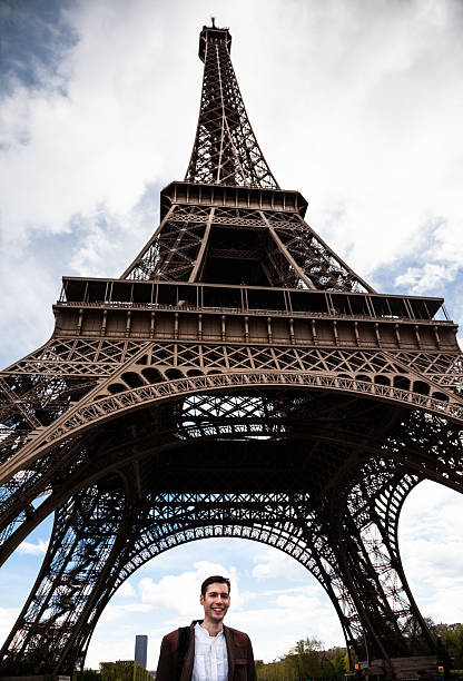 istock handsome young Frenchman visits the Eiffel Tower 527691512