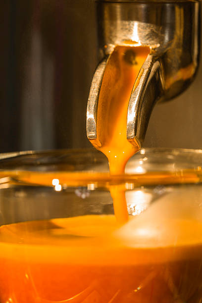 golden espresso flowing from single portafilter into the cup