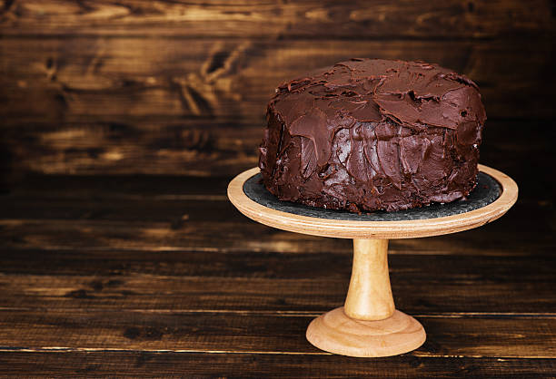 istock Chocolate cake on dark wooden bckground 527691826