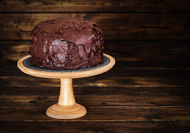 istock Chocolate cake on dark wooden bckground 527691924