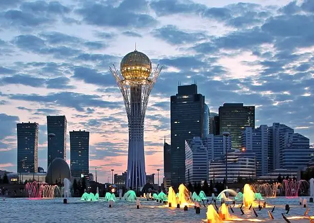 New centre of Astana capital city of Kazakhstan with landmark Baiterek tower at sunset