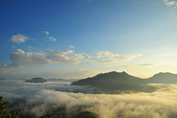 Mountain Landscape in the Fog at Sunrise stock photo