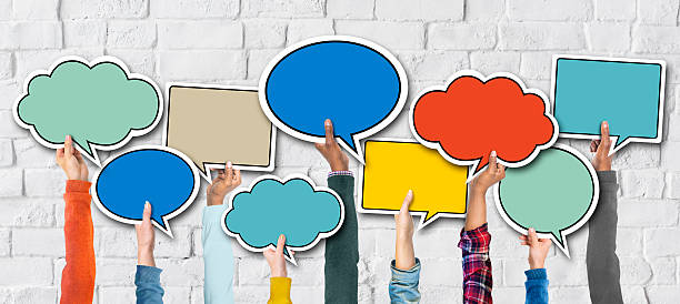 istock Diverse Hands Holding Colorful Speech Bubbles 527703791