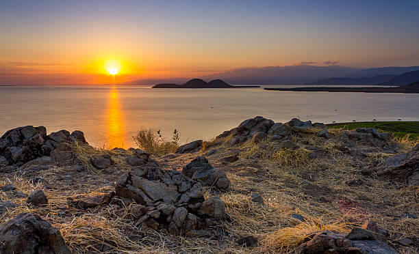 istock Sunrise over little island 527707553