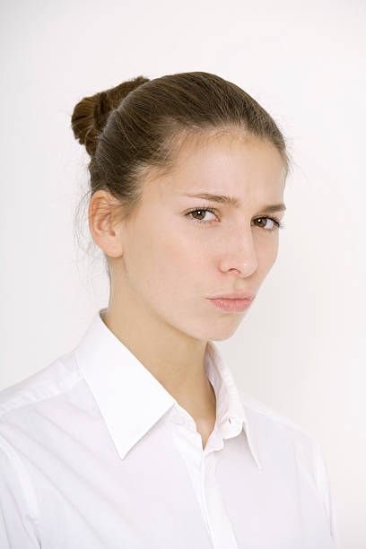 istock Young woman (16-17) looking skeptical, portrait 527707991