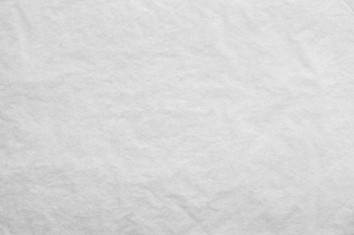 the textured clean sheet of crumpled paper of white color for pure and empty backgrounds