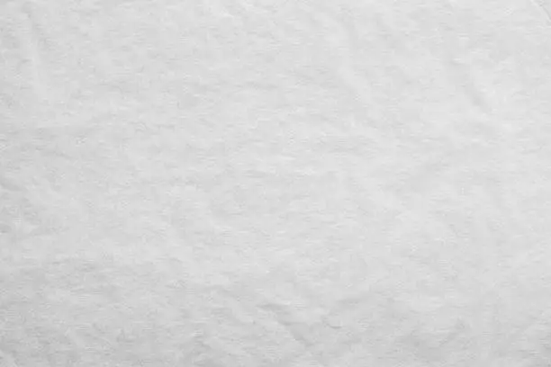 the textured clean sheet of crumpled paper of white color for pure and empty backgrounds