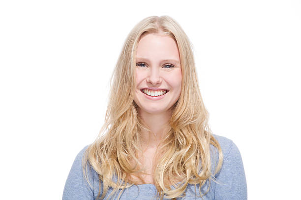 istock Young blonde woman smiling against white background 527722375