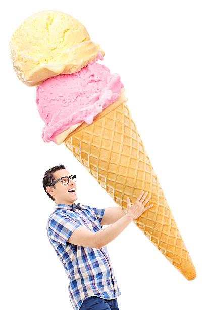 istock Cheerful young man carrying an enormous ice cream 527723165