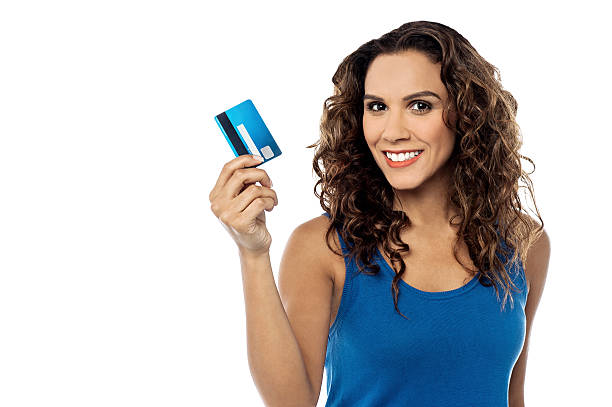 istock Attractive woman displaying her credit card 527723571
