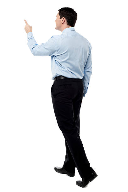 istock Back view of a middle aged man pointing finger 527724503