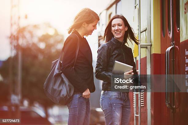 Young Women Waiting On The Train Station Leaving Tourist Stock Photo - Download Image Now