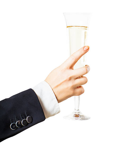 istock glass of champagne in hand 527724971