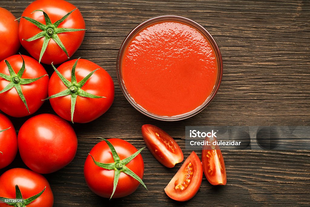 Tomato Fresh cherry tomato sauce on rustic wooden background Cherry Tomato Stock Photo