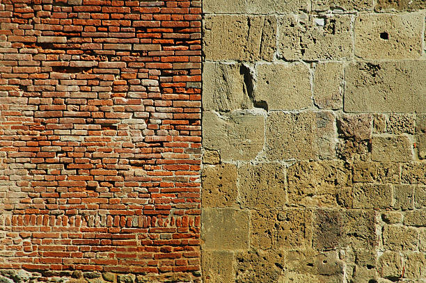 istock Old wall with bricks and stones. Pisa, Italy 527725629