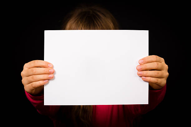 istock Child with blank white sign 527725781