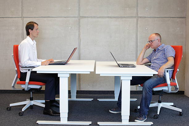 istock coorect and bad sitting postures at desk in office 527726965