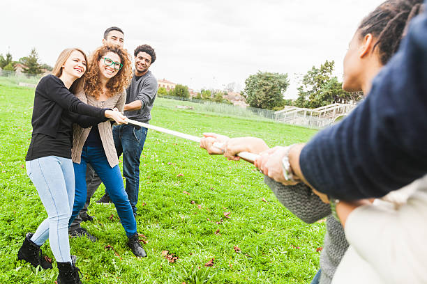 istock Multiracial People Playing Tug of War 527727441