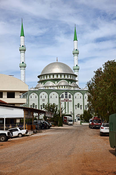 istock Turkish mosque with twin green spires 527727697