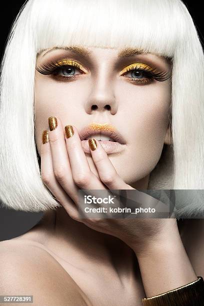 Beautiful Girl In White Wig With Gold Makeup And Nails Stock Photo - Download Image Now