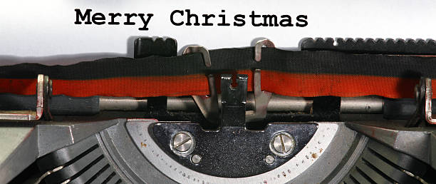 istock Typewriter Types MERRY CHRISTMAS  Closeup with black ink 527743531