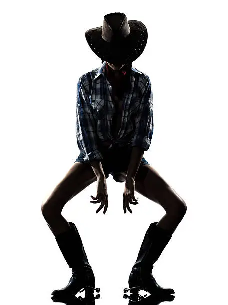 one woman cowgirl dancer happy dancing country music in studio isolated on white background