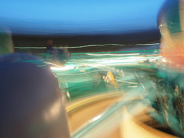 istock Lights In Motion At Amusement park 527744843