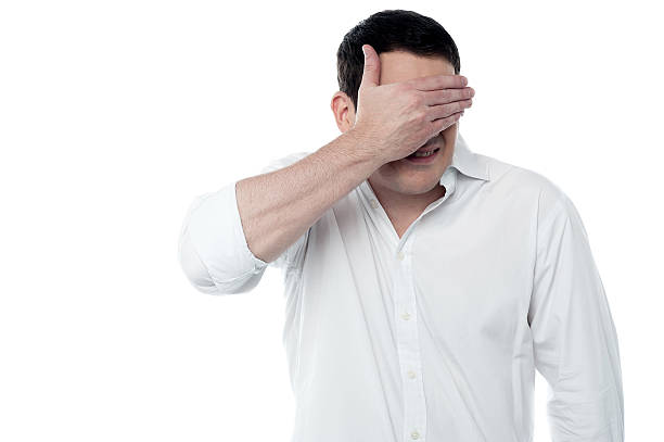 istock Handsome man covering his eyes with hand 527744905