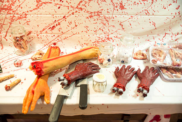 butchered humano sobre una mesa - dismembered fotografías e imágenes de stock