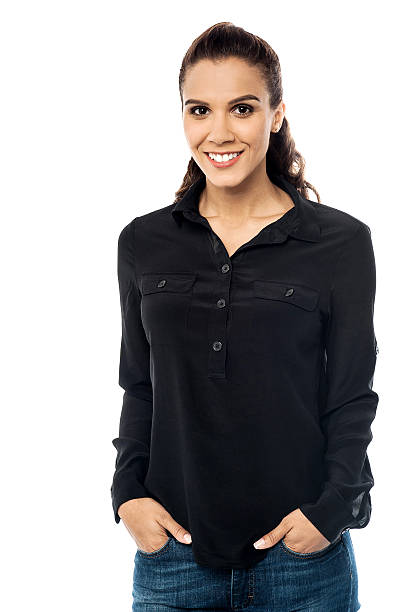 istock Smiling young woman with hand in pocket 527745783