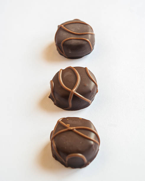 istock Tasty chocolate bonbon isolated on a white background 527745945