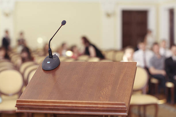 istock tribune speeches room microphone 527746491