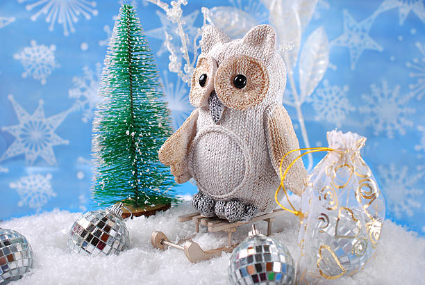 istock owl on sledge with gifts for christmas 527749387