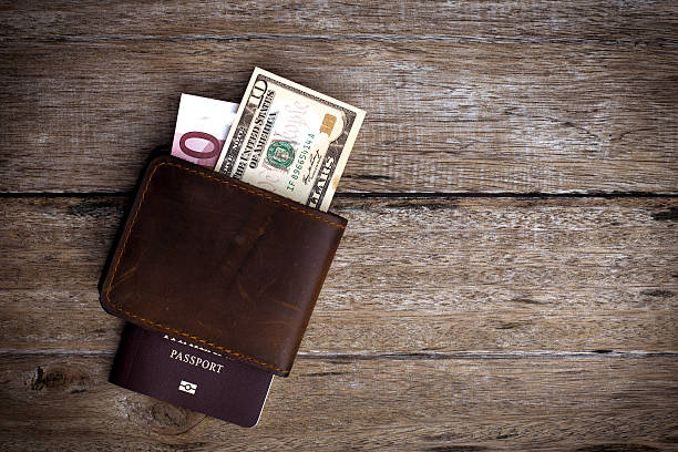 Passport with a note on a wooden table.