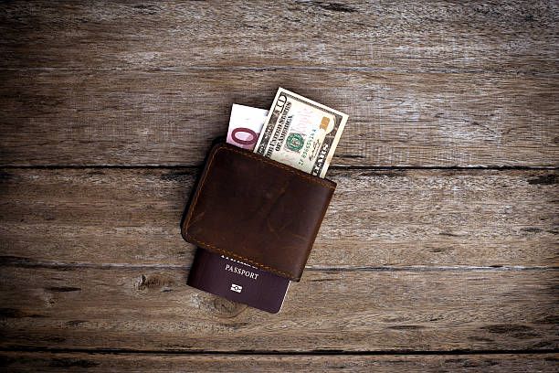 istock Passport with a note on a wooden table. 527758173