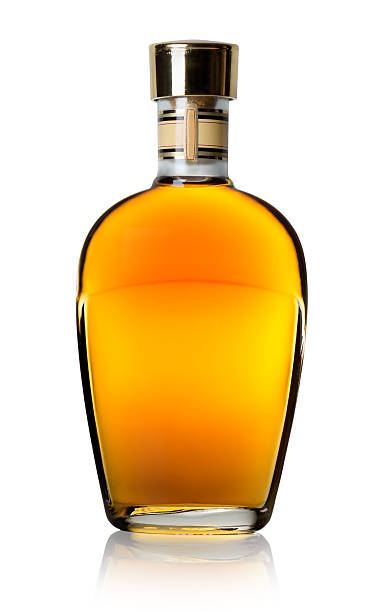 Cognac in a bottle Cognac in a bottle isolated on a white background cognac region photos stock pictures, royalty-free photos & images