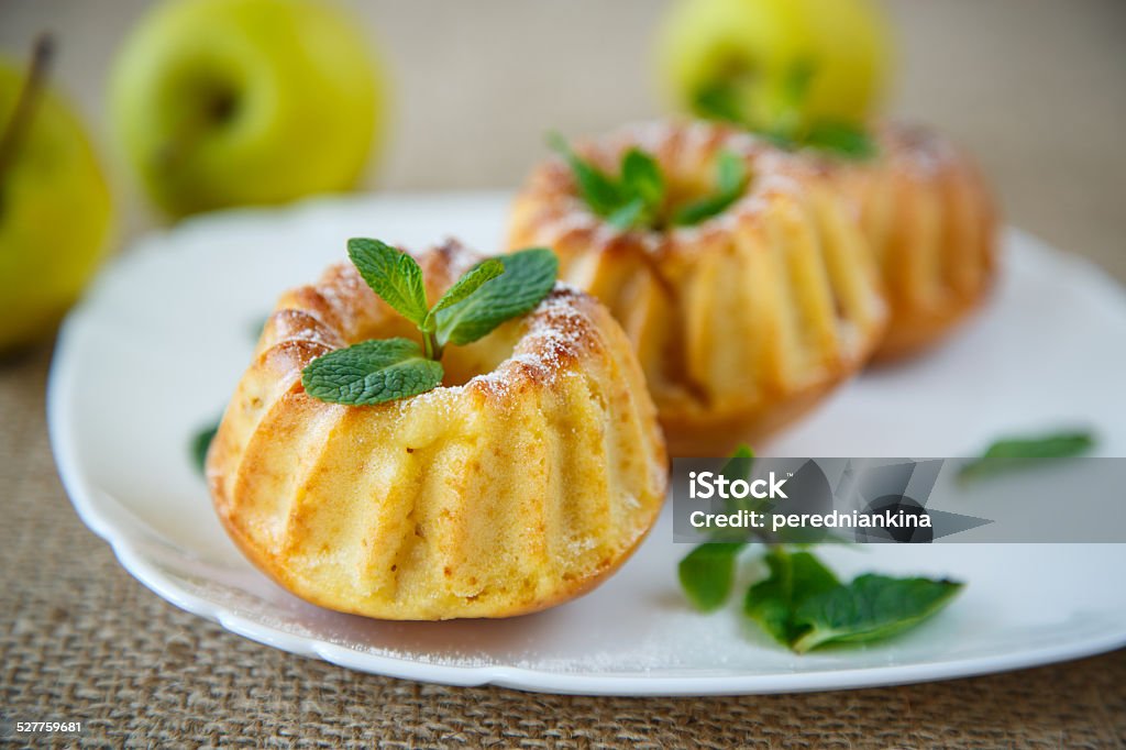 sweet apple muffins sweet apple muffins with powdered sugar and mint Almond Stock Photo