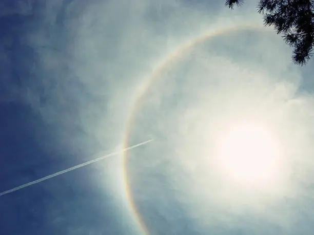 Rare occurance of a circle rainbow in the sky and around the sun.