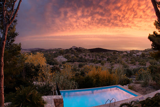 Secluded villa infinity pool at sunset  island of Majorca, Spain