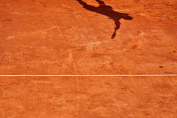 istock Tennis player shadow in action 527762265