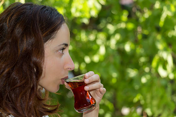 istock Young woman drinking turkish tea 527762443
