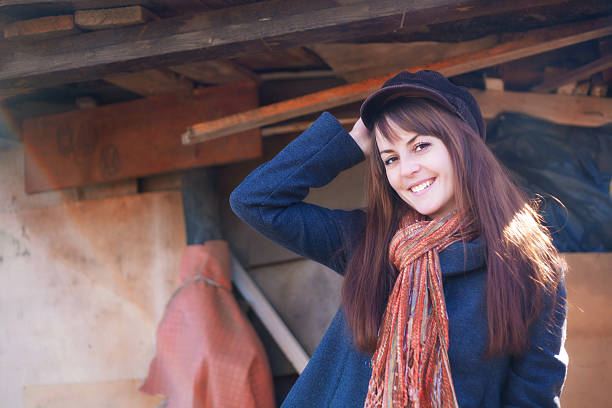 Cheerful girl in a cap on a sunny day