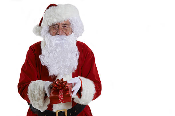 istock Studio Shot Of Santa Claus Holding Gift Wrapped Present 527787325