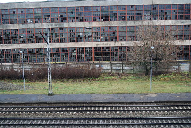 istock Abandoned old factory by the railroad 527795001