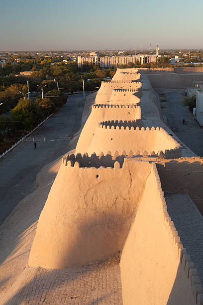 Khiva Ancient City Walls Ancient City Walls of Khiva in sunset khiva stock pictures, royalty-free photos & images