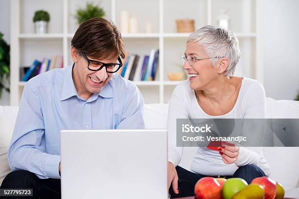 Maturesenior Couple Shopping Over Internet With Credit Card Stock Photo - Download Image Now