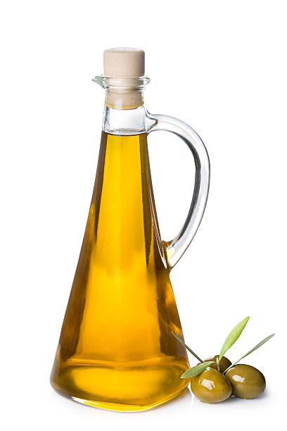 istock Extra olive oil bottle and green olives on white background 527798327